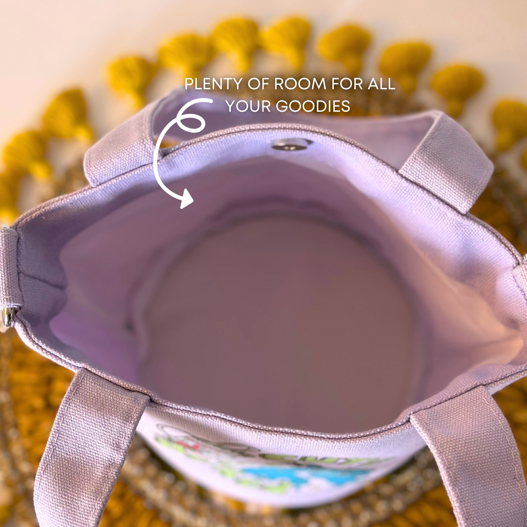 Open light purple handbag showing its spacious interior with text indicating room for all your goodies.